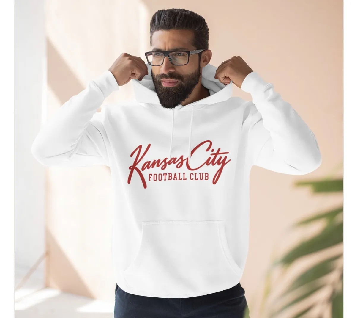 Kansas City Football Club Hoodie in White, on a model