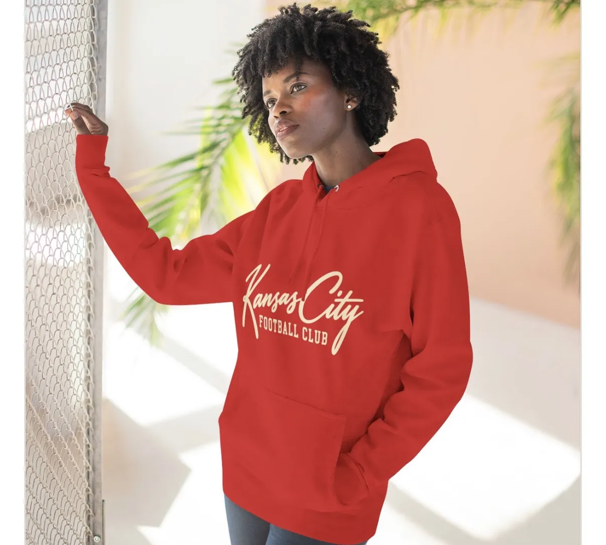 Kansas City Football Club Hoodie in Red, on a model
