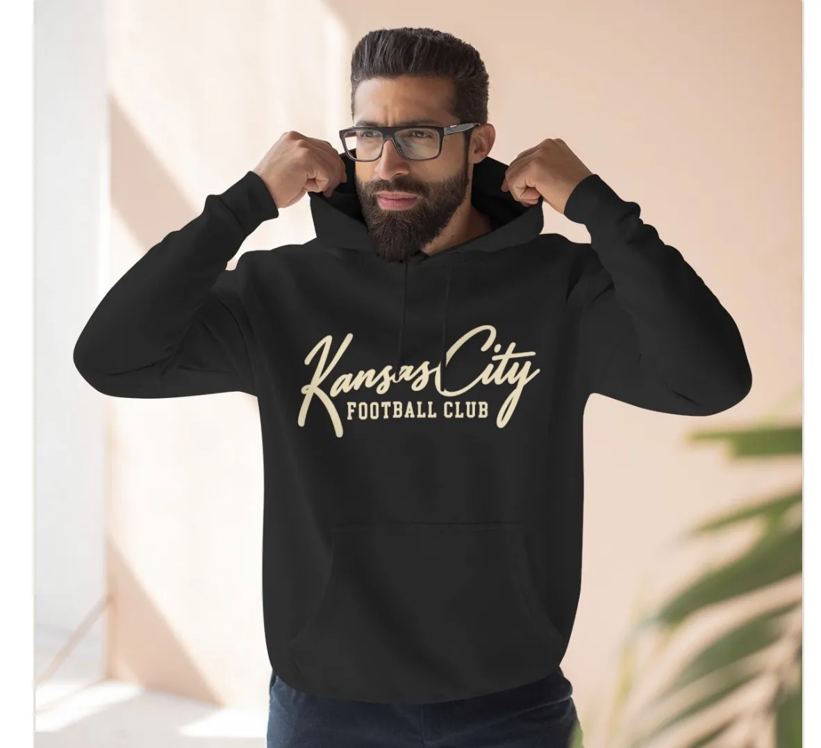 Kansas City Football Club Hoodie in Black, on a model
